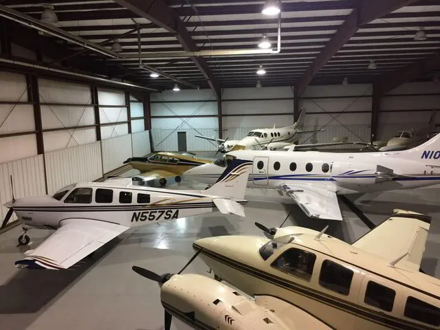 Aircraft positioned inside an aviation hangar